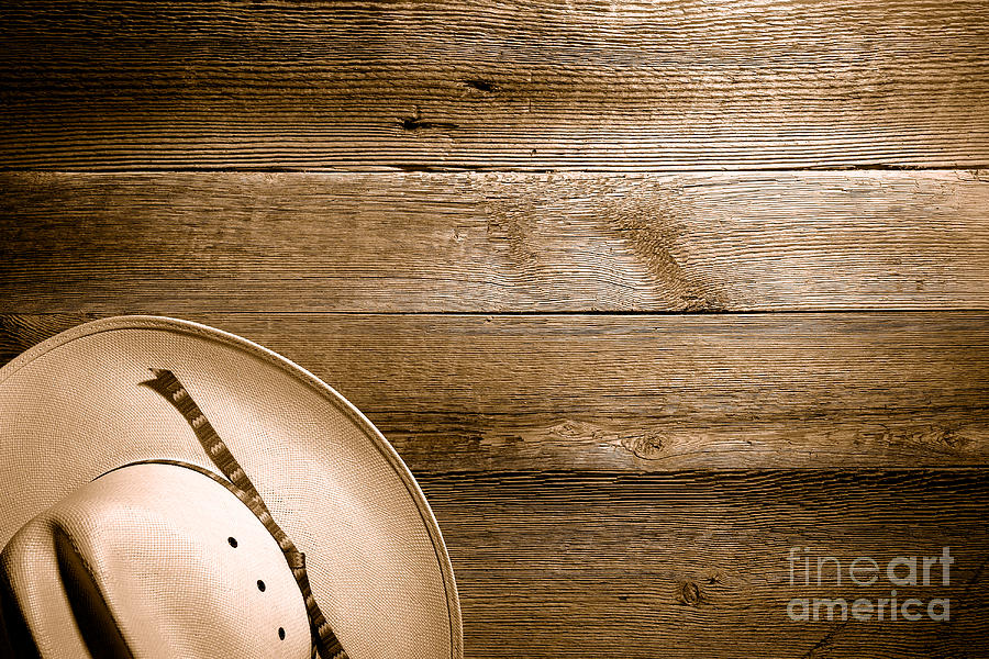 Cowboy Hat on Wood Table - Sepia Photograph by Olivier Le Queinec