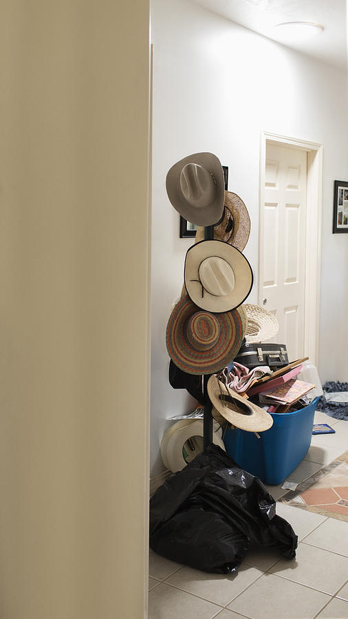 Cowboy hats hanging on hat rack Photograph by Hill Street Studios
