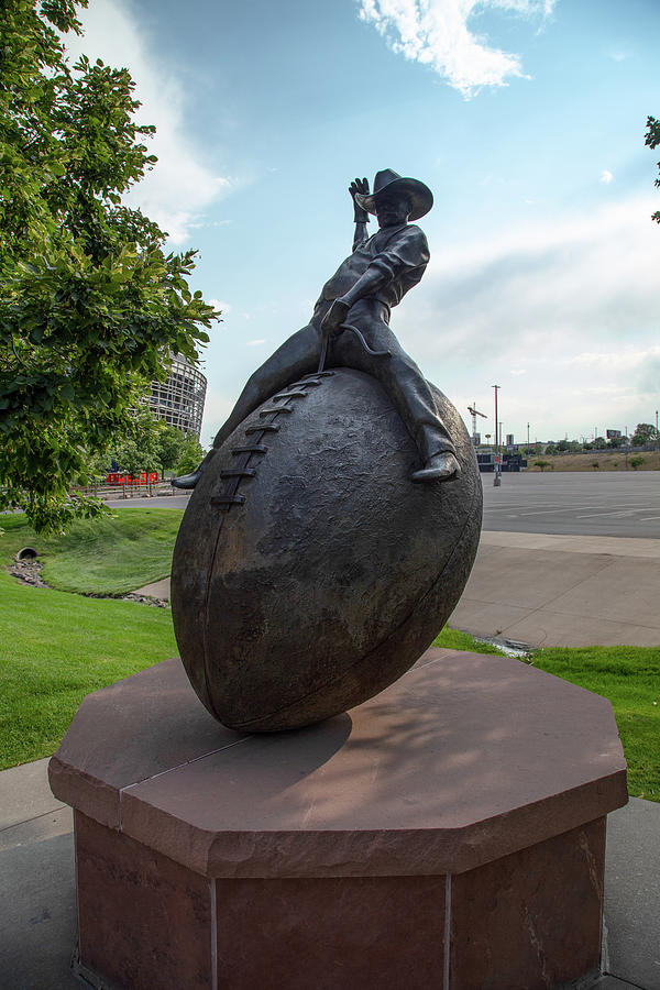 Cowboy riding football statue at Empower Field at Mile High Stadium in Denver Colorado Photograph by Eldon McGraw