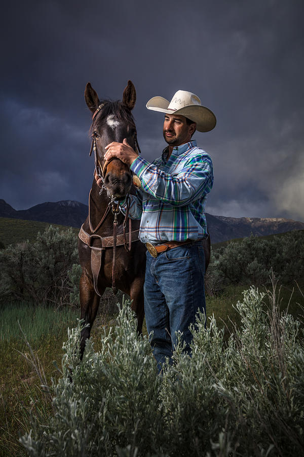 Cowboy Stroking Horses Nose Photograph by Halbergman