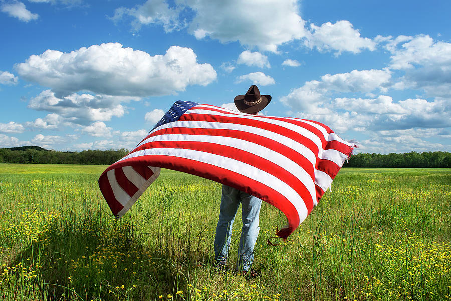 Cowboy Waving American Flag in Grassy Field Photograph by Jon Rehg - Pixels