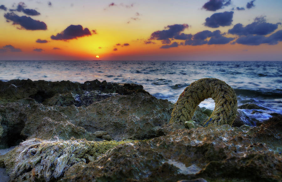 Cozumel Sunset on beach with anchor rope Photograph by Peter Herman
