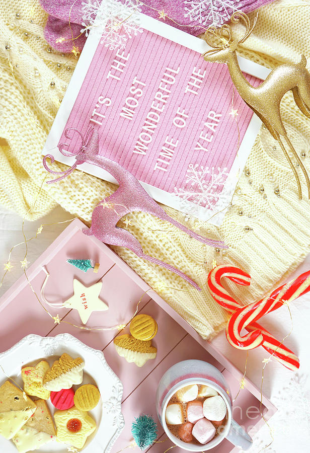 Cozy Christmas indoors tray of goodies with letter board flat lay overhead. Photograph by Milleflore Images