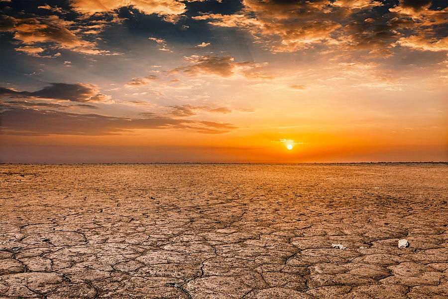 Cracked earth soil sunset landscape Photograph by F9photos