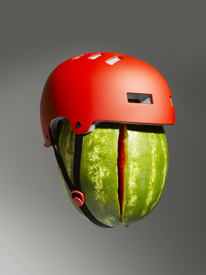 Cracked Watermelon and Helmet Photograph by Jeffrey Coolidge