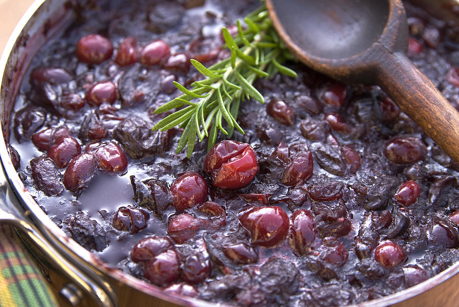 Cranberry sauce cooking for Christmas or Thanksgiving Photograph by Funwithfood