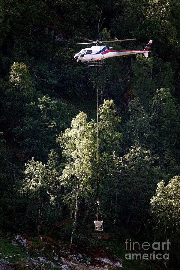 Crane Helicopter with Bucket Photograph by Olivier Le Queinec