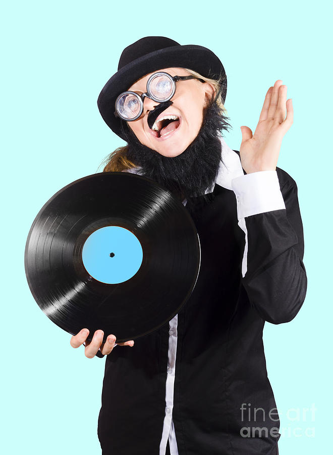 Crazy DJ rocking out with vinyl record Photograph by Jorgo Photography