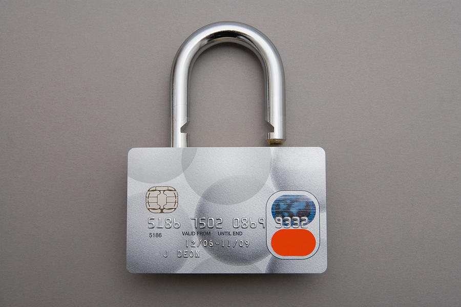 Credit card lock Photograph by Image Source