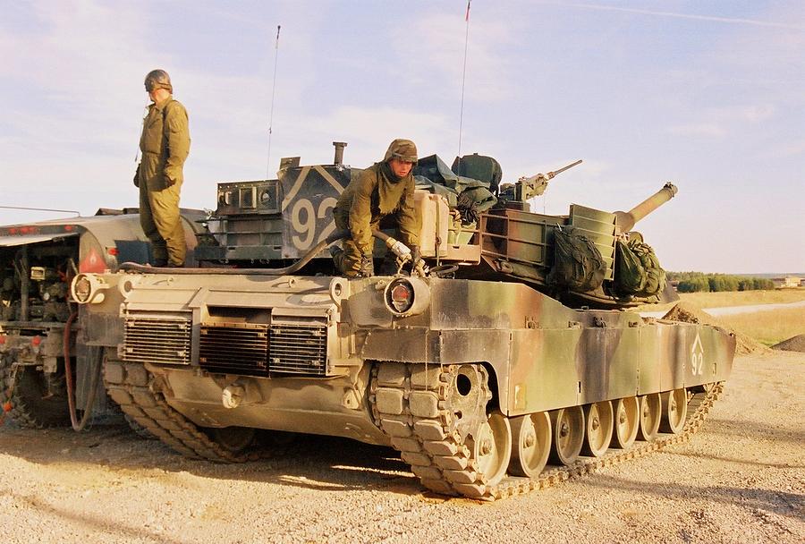 Crewmembers Refueling an M1 Abrams Tank Photograph by Arthur