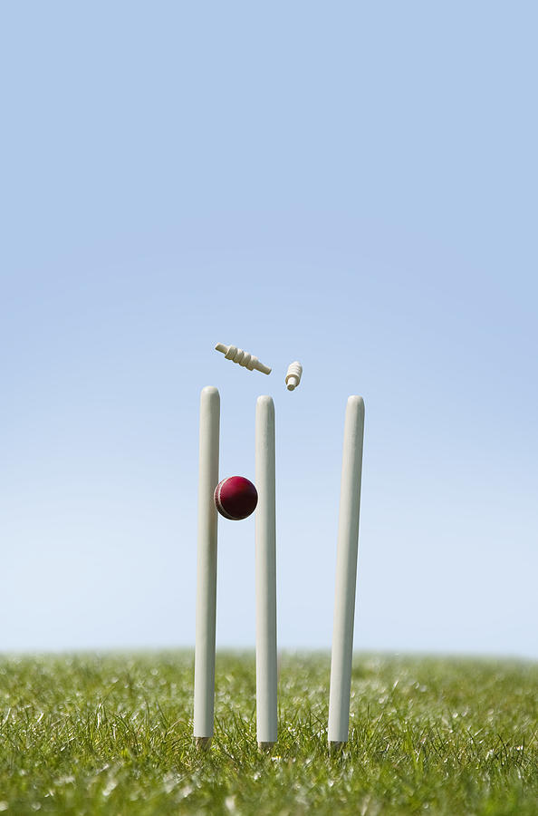 Cricket ball hitting the wicket Photograph by IndiaPix/IndiaPicture