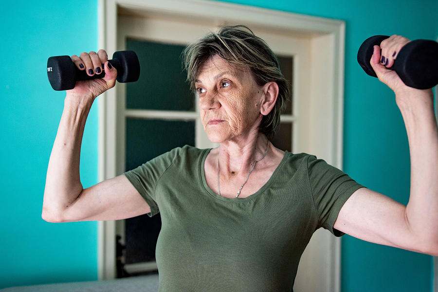 Cropped shot of a senior woman doing strengthening exercises Photograph by Gorica Poturak