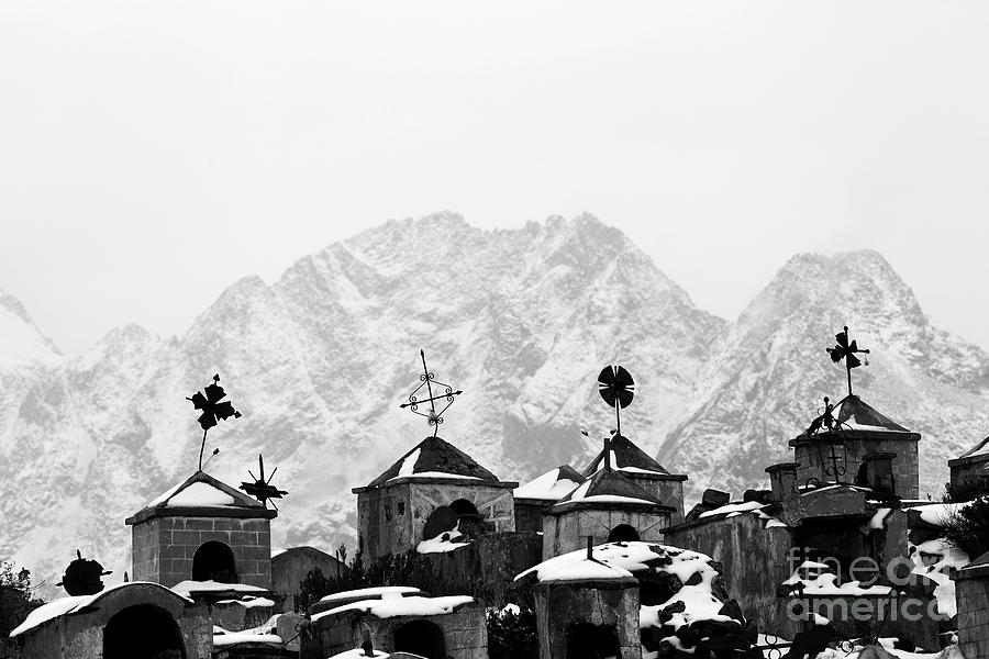 Crosses and tombs at Milluni cemetery in winter Bolivia Photograph by James Brunker
