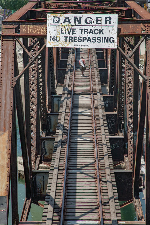 Crossing the San Lorenzo Train Bridge. Photograph by Tommy Farnsworth