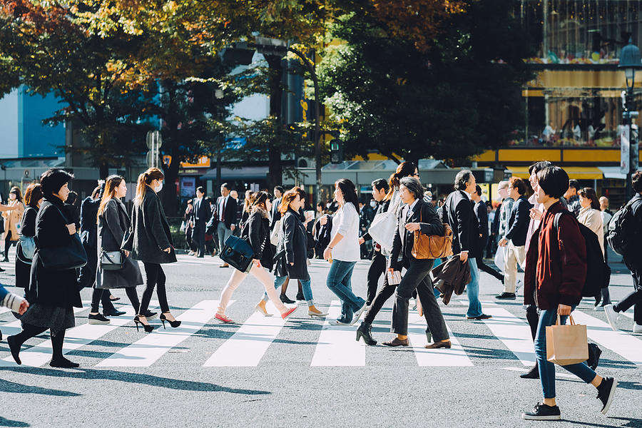 Crowd of busy commuters crossing street in Shibuya crossroad, Tokyo Photograph by D3sign
