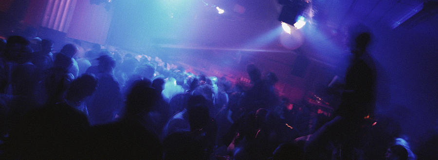Crowd of people dancing at nightclub Photograph by Matthieu Spohn
