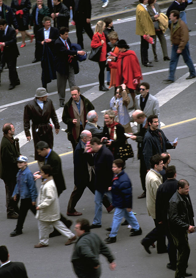Crowd walking in street, view from above, blurred. Photograph by Frederic Cirou