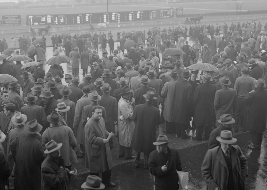 Crowds at horse race Photograph by George Marks
