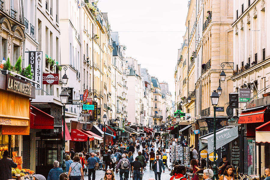 Crowds of people at Rue Montorgueil pedestrian street in Paris, France Photograph by Alexander Spatari