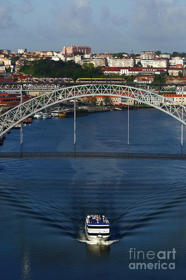 Boat Photograph - Cruise boat passing the Dom Luis I Bridge Porto Portugal by James Brunker