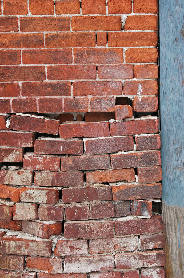 Crumbling brick wall. Photograph by Rob Huntley