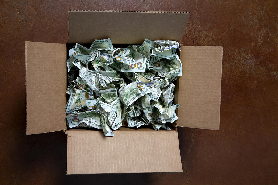 Crumpled 100 USD bills in box Photograph by joSon