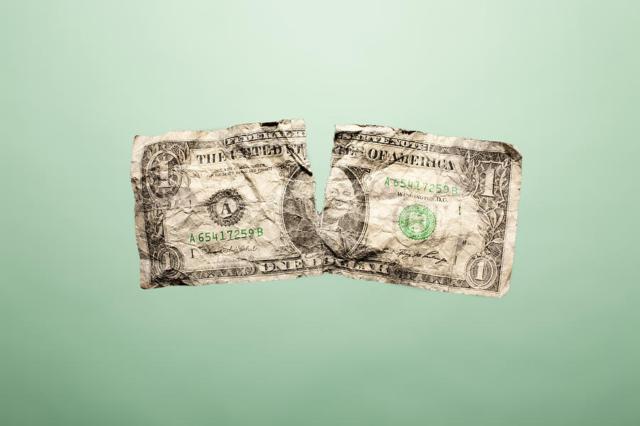 Crumpled up and torn dollar bill Photograph by Chris Parsons