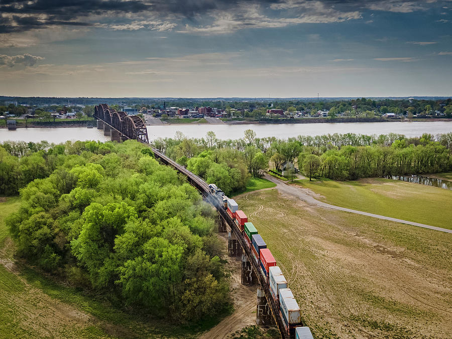 CSX Q025 Southbound prepares to cross the Ohio River Photograph by Jim Pearson
