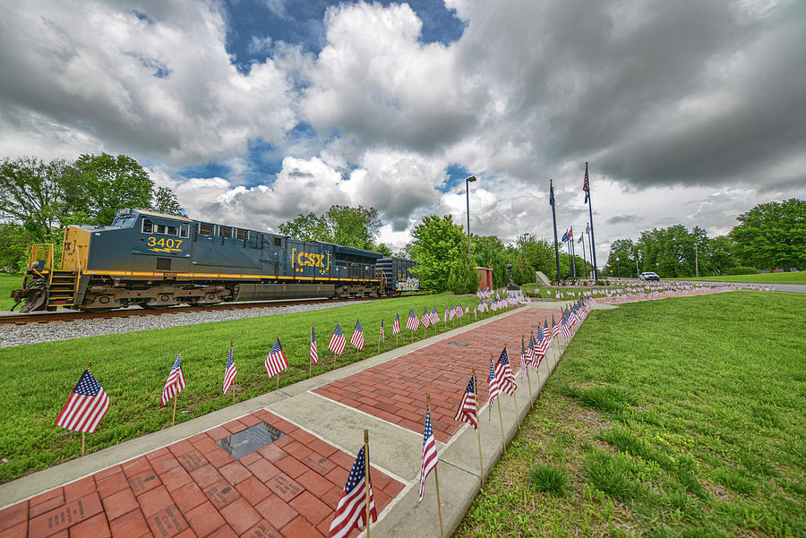 CSX Q502 Passing the Veterans Memorial at Madisonville Ky Photograph by Jim Pearson