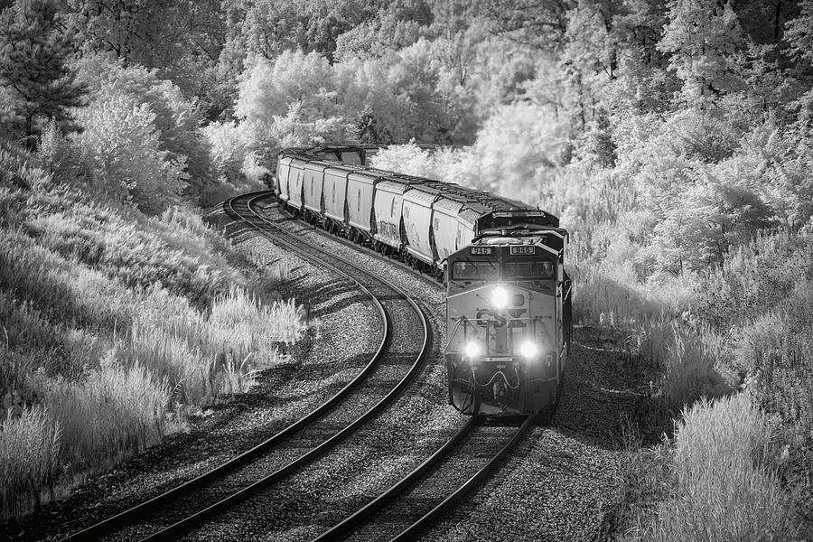CSX Q647 heads south through the S curve at Nortonville KY Photograph by Jim Pearson