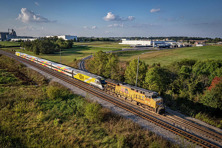 CSX W989 SB with a Brightline Commuter Trainset at Hopkinsville KY Photograph by Jim Pearson