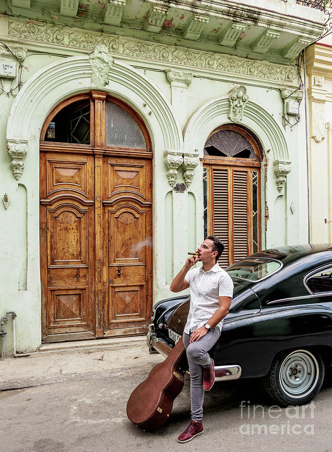 cuban-musician-smoking-cigar-at-la-habana-vieja-havana-la-habana-province-cuba-karol-kozlowski.jpg