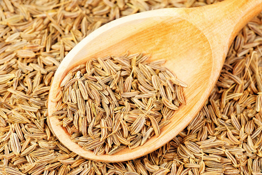 Cumin Seeds Macro And Wooden Spoon As Background Photograph by Hsagencia