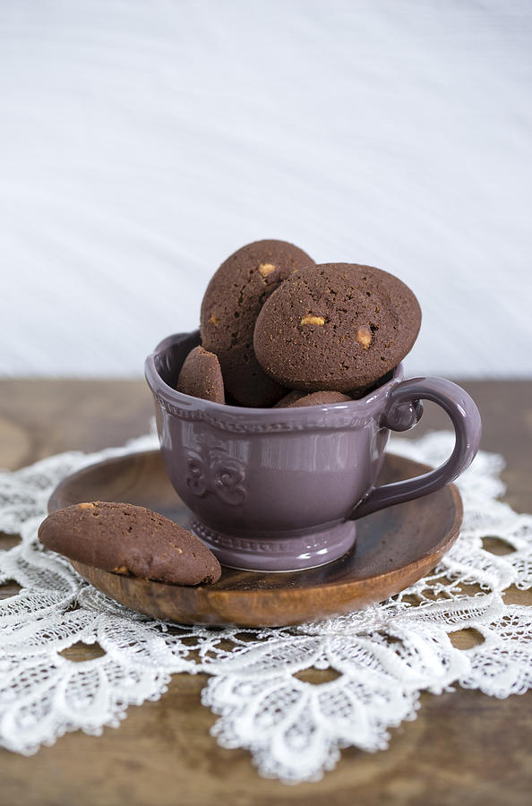 Cup of chocolate cookies with chunks of white chocolate Photograph by Westend61