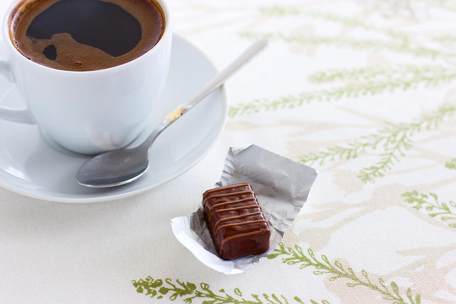 Cup of coffee and chocolate candy Photograph by OleksandraUsenko