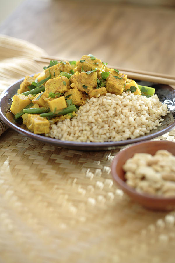 Curry soy tempeh and rice in bowl Photograph by John Block