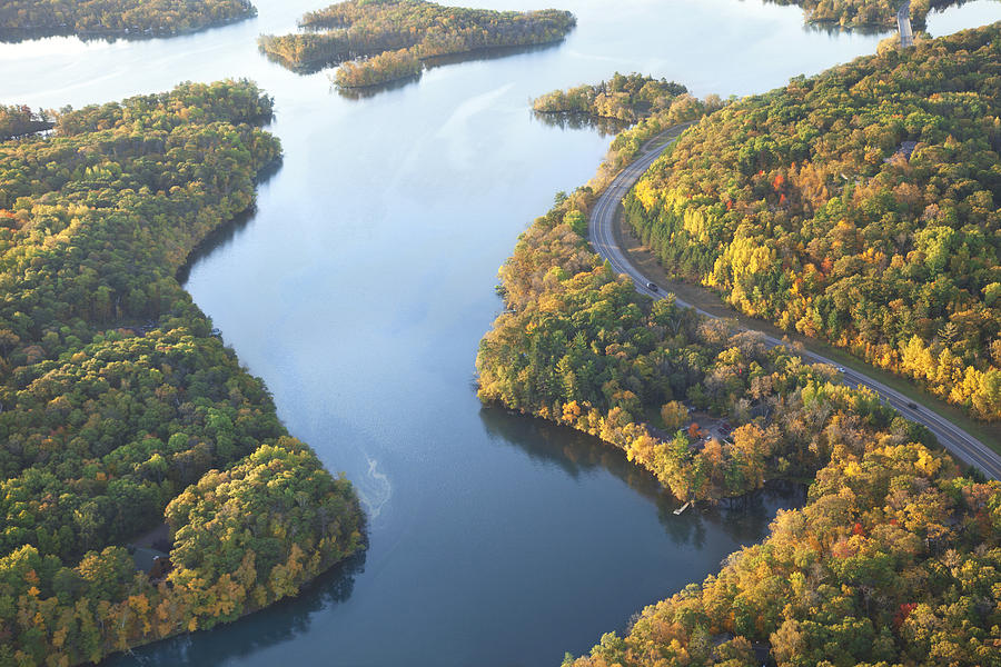 Curving road along Mississippi River during autumn Photograph by Willard