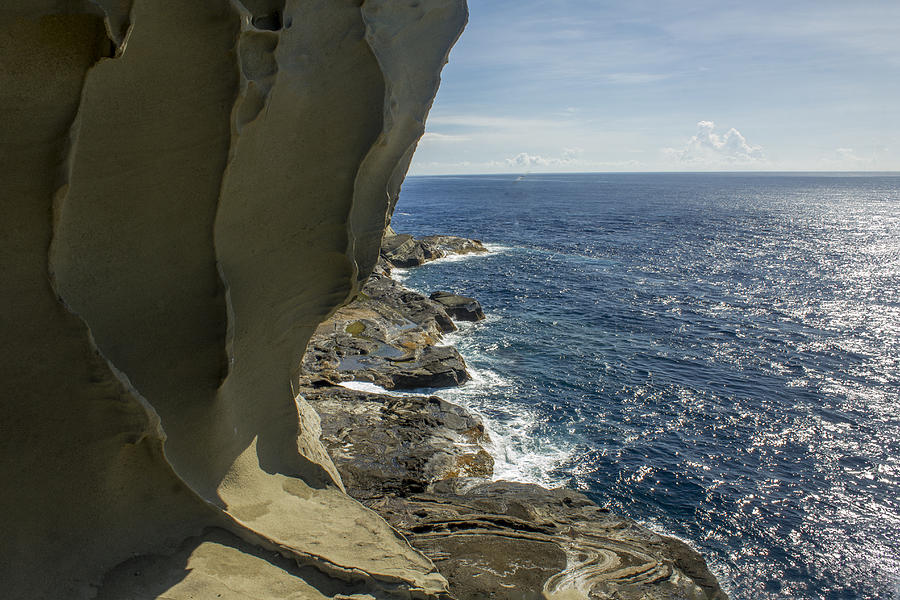 Curvy line on the rocks leading to the beach shore Photograph by Chris Dela Cruz