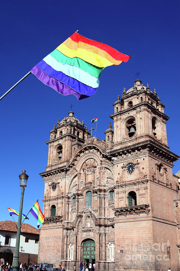 Cusco city flag and Compania de Jesus church Peru Photograph by James Brunker