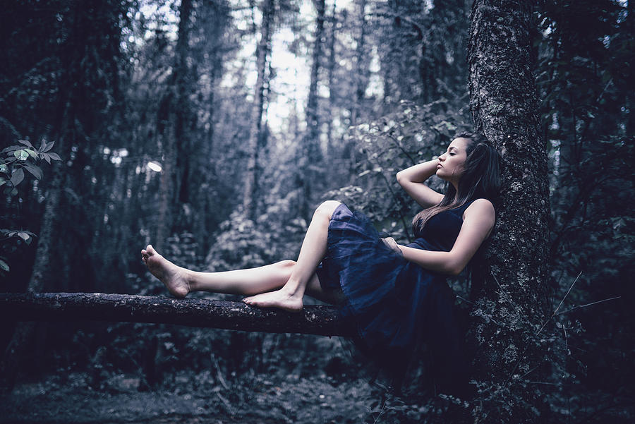 Cute Barefoot Female Sitting On Branch In Rainforest Photograph by AleksandarGeorgiev