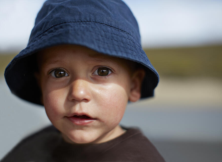 Cute boy with big eyes and hat, looking in camera Photograph by Klaus Vedfelt