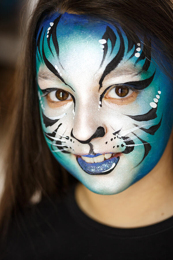 Cute girl with face paint Photograph by Fotostorm