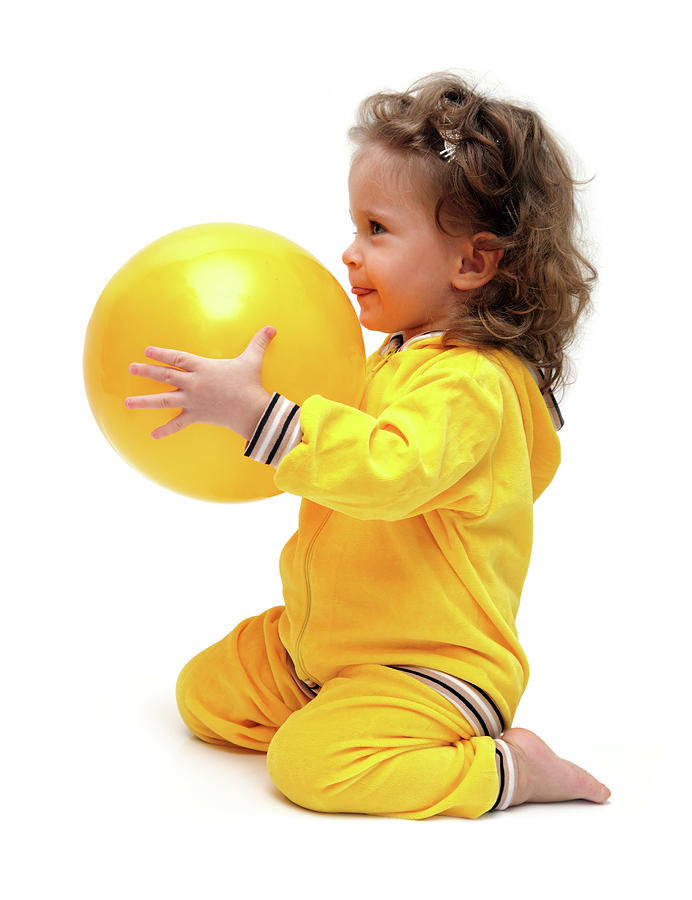 Cute Little Girl Playing With Ball Photograph by Mikhail Kokhanchikov