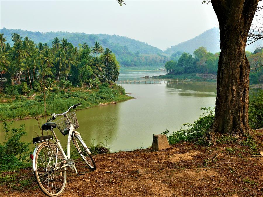 Cycling along Mekong River Photograph by Robert Bociaga