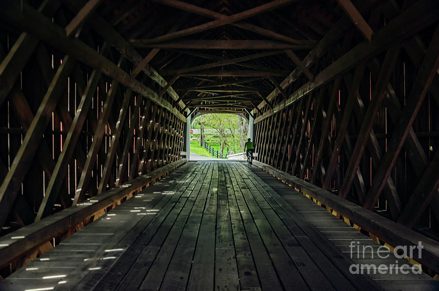 Cycling through Knechts Covered Bridge Photograph by Debra Fedchin