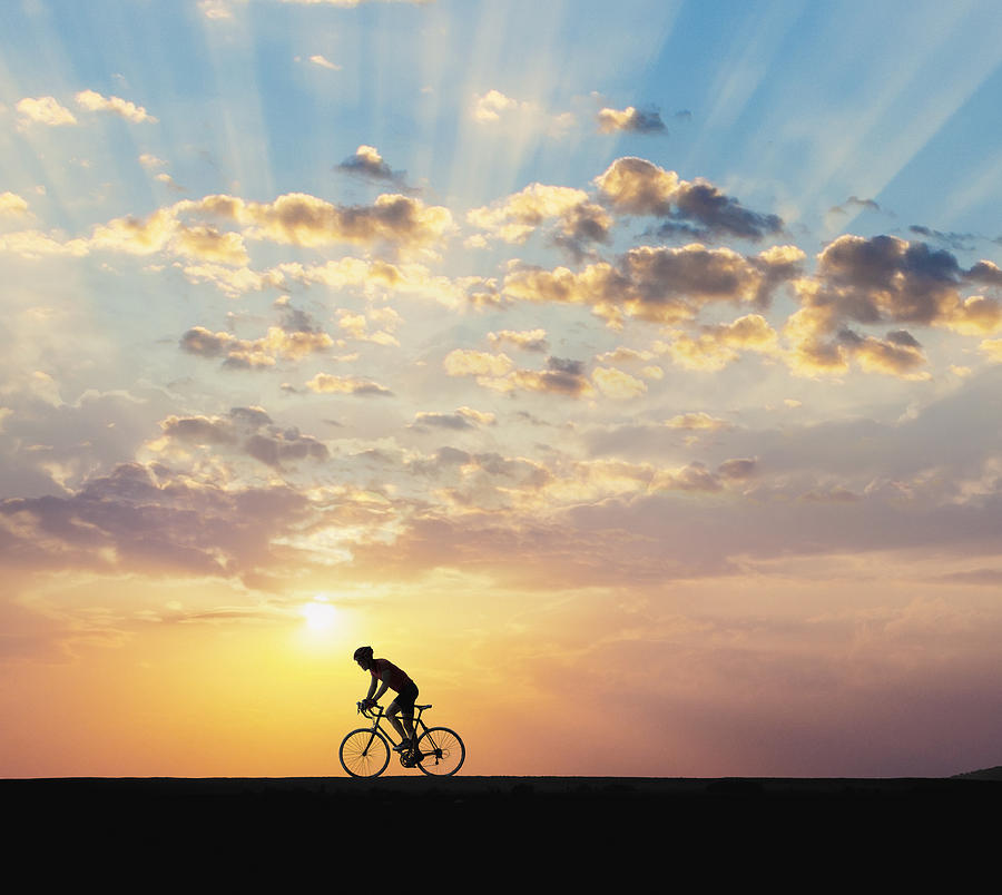 Cyclist At Dawn Photograph by John Lund