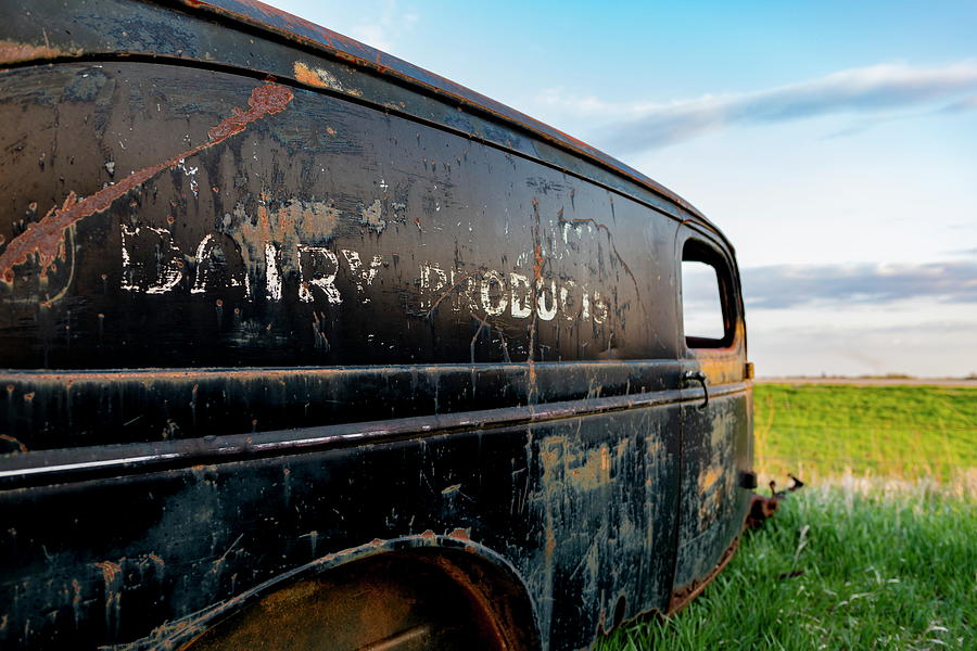 Dairy Products - Old truck in a field Photograph by Art Whitton
