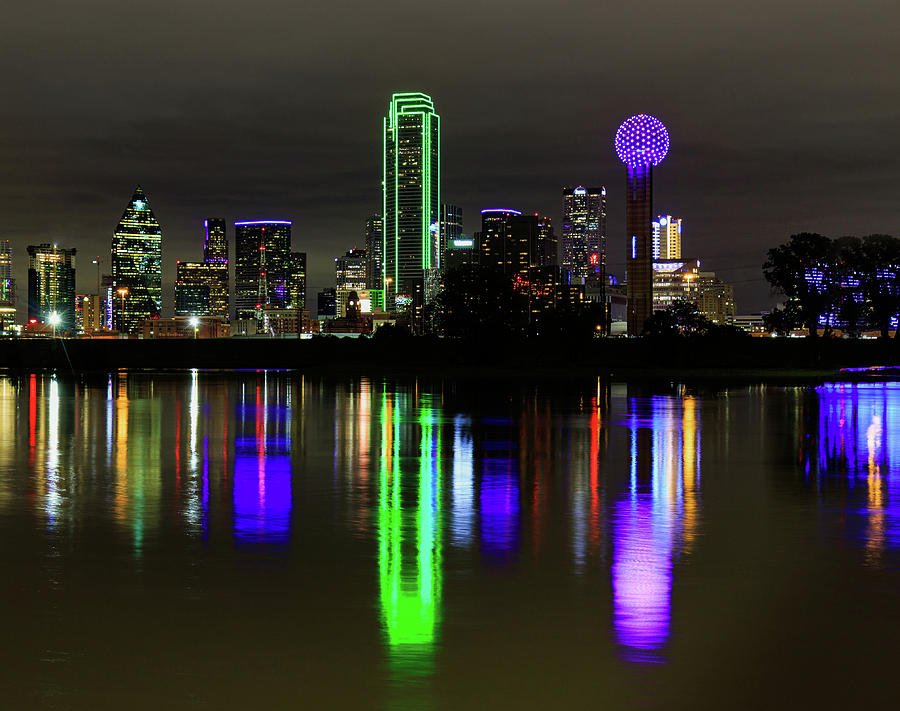 Dallas Texas skyline and the flooded trinity river with reflections and a purple Reunion Tower Photograph by David Ilzhoefer