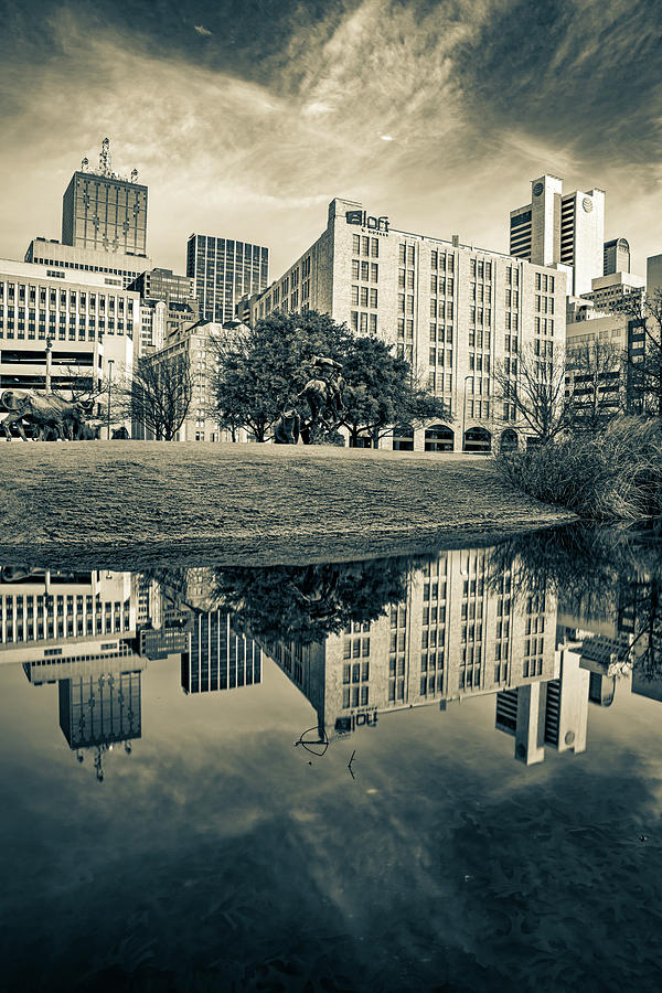 Dallas Texas Skyline On Still Waters At Pioneer Plaza - Sepia Edition Photograph by Gregory Ballos