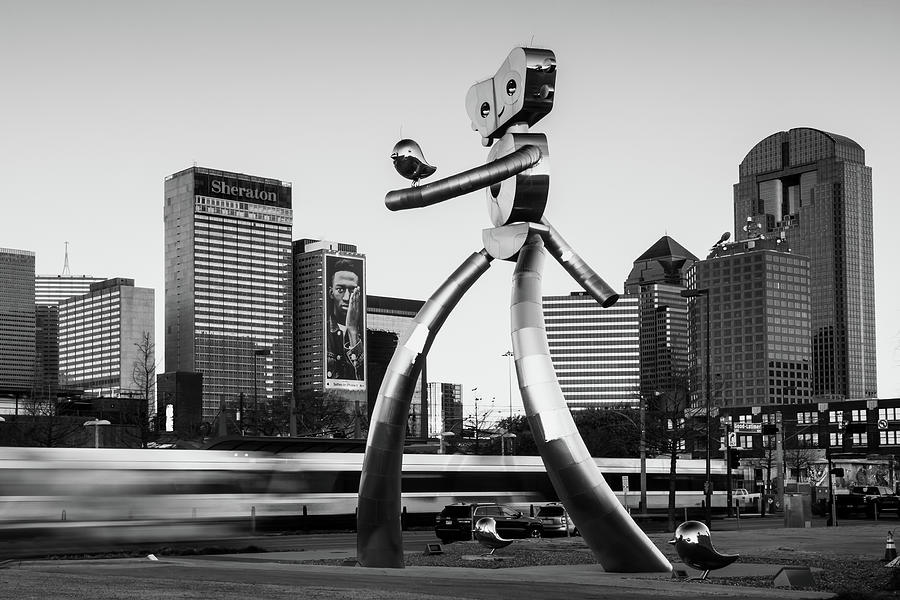 Dallas Texas Skyline Walking Tall Traveling Man - Black and White Photograph by Gregory Ballos